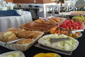 a buffet of different types of food on a table at igu falls in Foz do Iguaçu