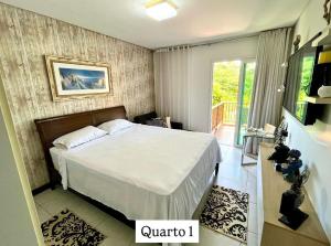 a bedroom with a bed and a balcony at Casa de Praia em Carneiros in Tamandaré +24 photos