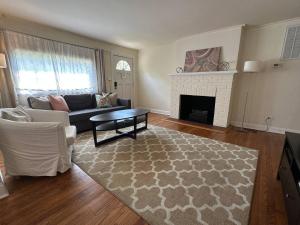 a living room with a couch and a fireplace at Prime Spot Staysimple Comfort, Perfect Location in Annapolis