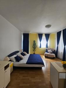 Ένα ή περισσότερα κρεβάτια σε δωμάτιο στο Rooms MIG