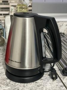 a silver and black toaster sitting on a counter at La Alameda you will feel pampered by the comfort in Nuevo Casas Grandes