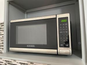 a microwave oven sitting on top of a counter at La Alameda you will feel pampered by the comfort in Nuevo Casas Grandes +33 photos