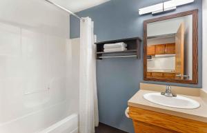 a bathroom with a sink and a mirror at Extended Stay America Select Suites - Fort Myers in Fort Myers +29 photos