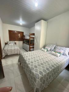 a bedroom with two beds in a room at Casa de Praia em Joanes - Salvaterra in Joanes