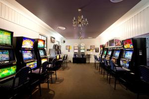 a room filled with lots of slot machines at Lamington Hotel Motel - Detached Motel in Maryborough