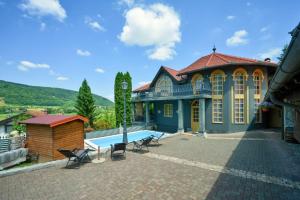 a large house with a swimming pool in a yard at Family friendly house with a swimming pool Benkovec, Zagorje - 24902 in Bednja