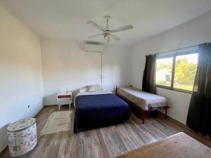 En eller flere senge i et værelse på Quinta El Descanso