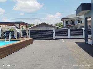 a fence around a swimming pool in a house at Paradijs in Paramaribo in Paramaribo