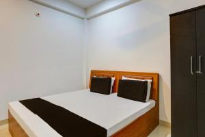 Postel nebo postele na pokoji v ubytování Hotel O Amantran Residency