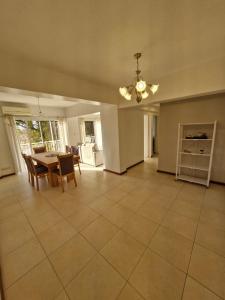 a large living room with a table and chairs at Consorcio 9 de Julio in San Juan