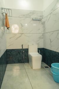 Koupelna v ubytování Coorg Saturn Homes + 32 fotografií