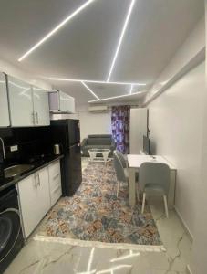a kitchen with a table and chairs in a room at Princess Resort hurghada in Hurghada