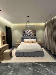 Postel nebo postele na pokoji v ubytování غرفة وصالة بدخول ذاتي - النزهة