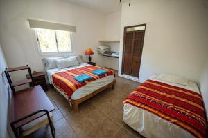 Ένα ή περισσότερα κρεβάτια σε δωμάτιο στο Casa Hokol penthouse departamento con alberca +9 φωτογραφίες