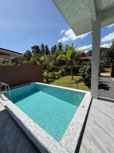 a swimming pool in a villa with a view at Private Pool Residences in Koh Phangan