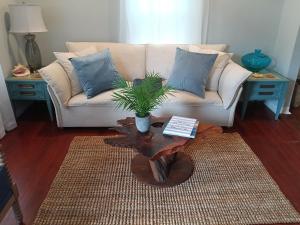 a living room with a couch and a coffee table at Deep Sea Dreams in Pensacola +72 photos