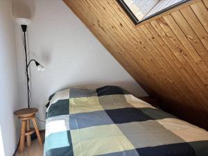 a bedroom with a bed in a attic with a window at Duplex 4 étoiles, Villard-de-Lans, 8 pers, lumineux - FR-1-548-49 in Villard-de-Lans +3 photos