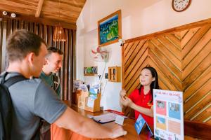 a group of people standing around a table in a room at StarHill Resort Phú Quốc in Phu Quoc +33 photos