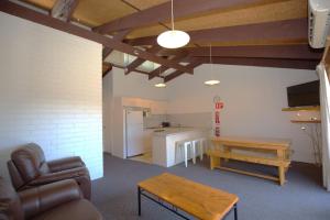 a living room with a couch and a table at Alpha Centauri - 8 - 39 Gippsland Street in Jindabyne