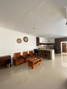 a living room with a couch and a table at NEW 4 BR Korin Villa Sanur in Sanur