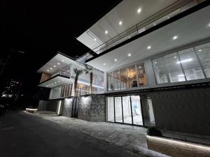 a night view of a building at night at Villa Palma in Tbilisi City