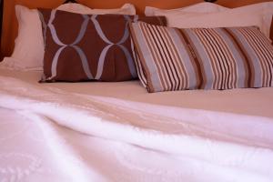 A bed or beds in a room at Asterida Villas