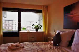 a bedroom with a bed in front of a window at Weststadtblick in Heidelberg