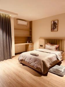Ένα ή περισσότερα κρεβάτια σε δωμάτιο στο LA Apartment