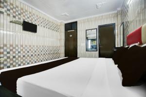 Postel nebo postele na pokoji v ubytování Hotel O K10 Grand