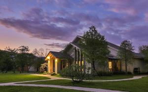 a house with lights on the front of it at Bear Forest Villa in Fengping