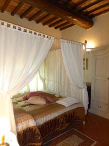 Postel nebo postele na pokoji v ubytování Fattoria di Colleoli