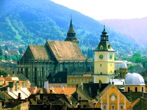 a group of buildings with a clock tower at Suri Guesthouse in Braşov