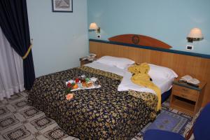 Voodi või voodid majutusasutuse Hotel Talao toas