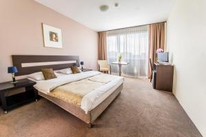 Postel nebo postele na pokoji v ubytování Hotel Cascade