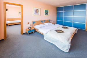 Postel nebo postele na pokoji v ubytování Hotel Cascade