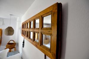 A bed or beds in a room at Lindos Esel Suites