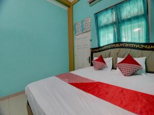 Postel nebo postele na pokoji v ubytování Hotel O Rania Kost Simpang Rimbo + 54 fotografií