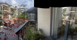a view of a street from a balcony of a building at Hanoi Old Quarter Hotel and Spa in Hanoi