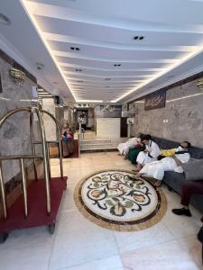 a group of people sitting on a couch in a room at Elaf Al bait ايلاف البيت in Mecca +16 photos