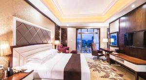 Télévision ou salle de divertissement dans l'établissement Country Garden Phoenix Hotel Maoming