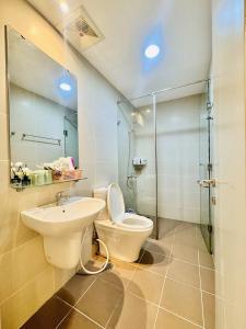 a bathroom with a toilet and a sink and a shower at The Vista Masteri Thao Dien N-Stay Apartment in Ho Chi Minh City