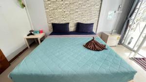 Postel nebo postele na pokoji v ubytování Kohmook Coco Hills Resort