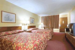 Giường trong phòng chung tại Americas Best Value Inn & Suites Greenville
