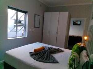 Ένα ή περισσότερα κρεβάτια σε δωμάτιο στο Neo & Ruks Rooms Parow 5