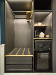 a stainless steel refrigerator with a stove at Lary's - San Pietro in Rome