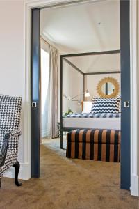 a bedroom with a large bed and a mirror at Inn at St. Botolph in Boston