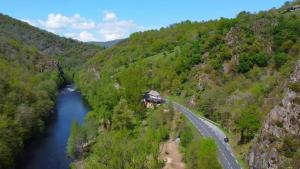 an aerial view of a bridge over a river at Studio au bord de la Rivière in Florentin-la-Capelle