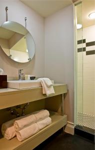 a bathroom with a sink and a mirror at Inn at St. Botolph in Boston