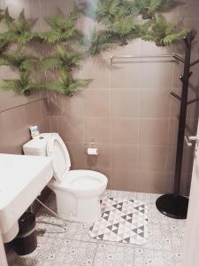 a bathroom with a toilet and a sink at La casita hua hin in Hua Hin +12 photos