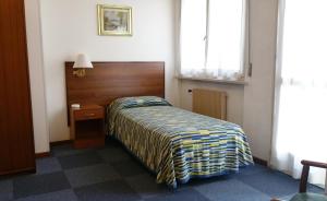 Postel nebo postele na pokoji v ubytování Hotel Capri